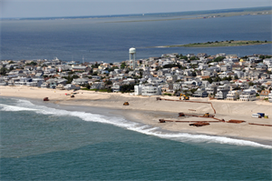 An aerial photograph captures contractors completing the Brant Beach storm damage reduction project in 2012. The beachfill work is designed to reduce storm damages to the community and infrastructure. 